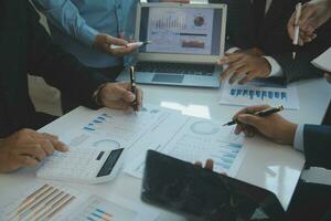 Team of business people are meeting to analyze data for marketing plan,Market research reports and income statistics, Financial and Accounting concept. photo