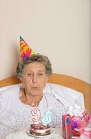 Old woman celebrates her birthday photo