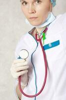 A professional stethoscope in the hand of a doctor. Closeup photo