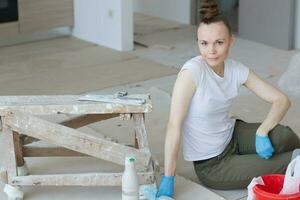 Young lady renovates  apartment photo