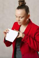 Young caucasian lady  keeps an envelope. Closeup photo