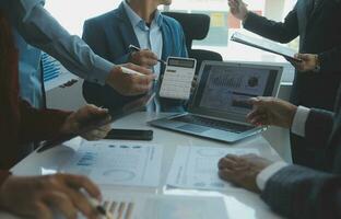 Team of business people working together in the meeting room office, teamwork background charts and graphs banner, double exposure successful teamwork,business planning concept. photo