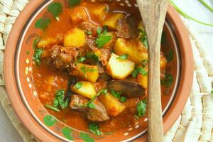 Oven stewed potatoes with chicken liver photo