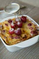 Cherry mini pie in the ceramic baking mould photo