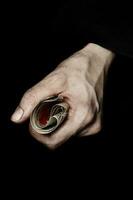 Palm of a peasant woman with old banknotes on a black fabric. Closeup photo