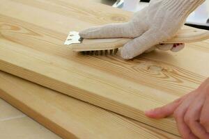 Process of polishing the wood before painting. Closeup photo