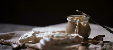 Homemade almond butter on a slice of rice crispbread. photo