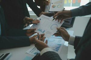 Team of business people are meeting to analyze data for marketing plan,Market research reports and income statistics, Financial and Accounting concept. photo