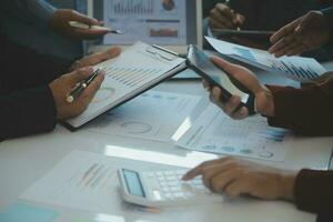 Team of business people are meeting to analyze data for marketing plan,Market research reports and income statistics, Financial and Accounting concept. photo