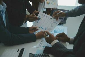 Team of business people are meeting to analyze data for marketing plan,Market research reports and income statistics, Financial and Accounting concept. photo