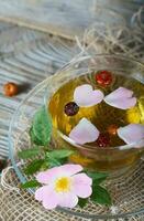Rose hip herbal tea on a wooden surface. Free text. photo