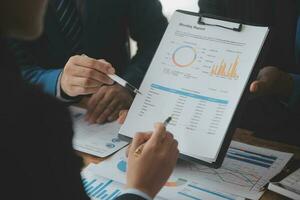 Team of business people working together in the meeting room office, teamwork background charts and graphs banner, double exposure successful teamwork,business planning concept. photo