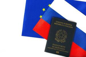 Service passport of an Italian official on Russian and European flag.Closeup photo