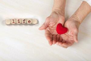 Word LIFE composed of wooden dices. photo