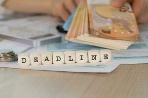 Word DEADLINE composed of wooden letters. photo