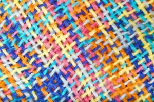 Colorful knitted surface. Closeup photo