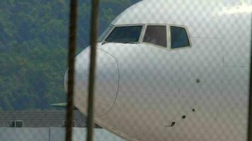 PHUKET, THAILAND NOVEMBER 16, 2019 - Cockpit of widebody airplane turn runway before departure from Phuket airport. video