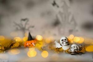 Skull on an old used thick candle. Scary Halloween background. photo