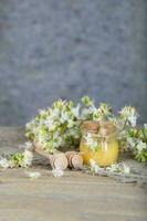 Chestnut honey on a wooden surface. photo