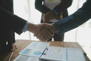 Business handshake for teamwork of business merger and acquisition,successful negotiate,hand shake,two businessman shake hand with partner to celebration partnership and business deal concept photo