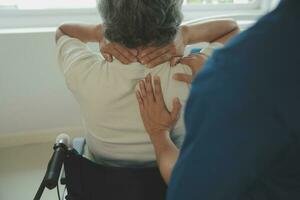 A Modern rehabilitation physiotherapy worker with senior client photo