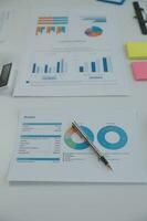 Team of business people working together in the meeting room office, teamwork background charts and graphs banner, double exposure successful teamwork,business planning concept. photo