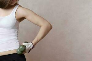 Young lady with dumbbells. photo