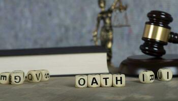 Word OATH composed of wooden letters. photo