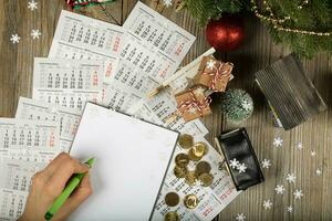 Blank sheet of paper and small purse with coins on the New Year's background. photo