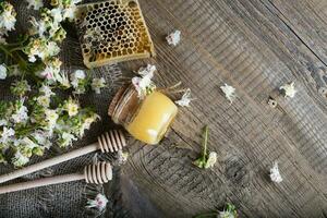 Chestnut honey on a wooden surface. photo