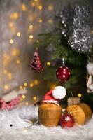 Traditional Italian cake- panettone in Santa Claus hat. photo