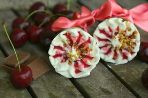 Cherry vanilla ice-cream with caramel topping. Closeup photo