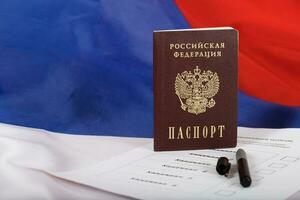 Russian passport on a approximate sample of ballot paper for presidential elections. photo