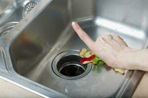 Food waste in a kitchen sink photo