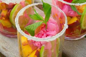 Fruit salad with strawberry ice cream photo