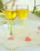 Two white wine glasses photo