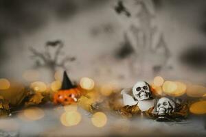 Skull on an old used thick candle. Scary Halloween background. photo