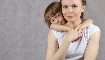 Young mother with her 3 years old son. photo