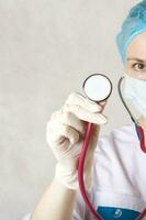 A professional stethoscope in the hand of a doctor. Closeup photo