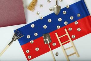 Agricultural tools on a Russian flag photo