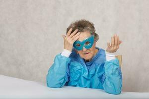 Senior woman in a cosmetological cabinet photo