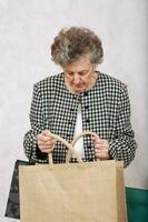 Old woman with shopping bags photo