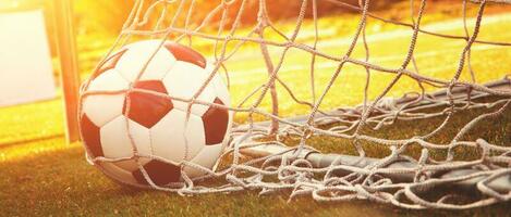 Soccer ball in the net of a goal. Soccer concept photo