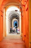 Bologna,Italy- June 23, 2023-People stroll at night under the arcades leading to the sanctuary of San Luca illuminated for the first edition of the Bologna arcades Festival. photo