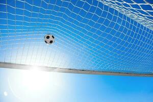 Soccer ball in the net of a goal. Soccer concept photo