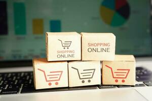 Online shopping, Shopping cart box on business graph, import export, finance commerce. photo