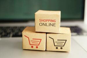 Online shopping, Shopping cart box on business graph, import export, finance commerce. photo