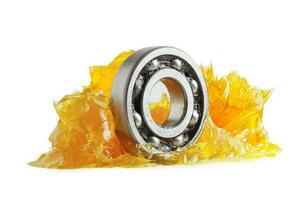 Grease and ball bearing  isolated on white background with clipping path, lithium machinery lubrication for automotive and industrial. photo