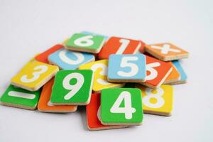 Number wood block cubes for learning Mathematic, education math concept. photo