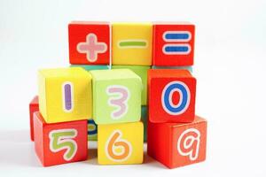 Number wood block cubes for learning Mathematic, education math concept. photo